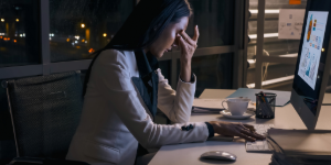 Why 75percent of Small Businesses Change Marketing Providers Within a Year tired woman business founder at desk at night